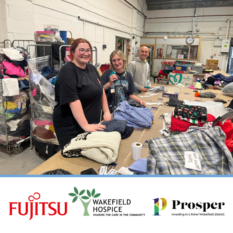 Fujitsu volunteer at Wakefield Hospice warehouse sorting clothing