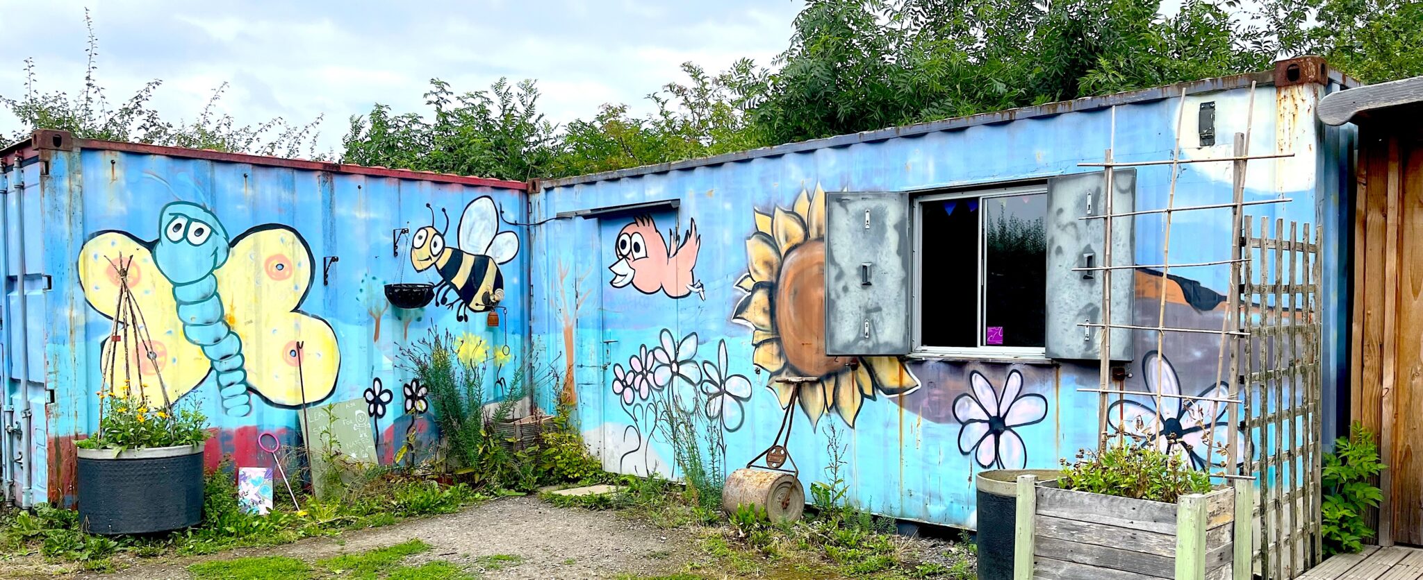 Brughtly painted containers that have been made into work spaces