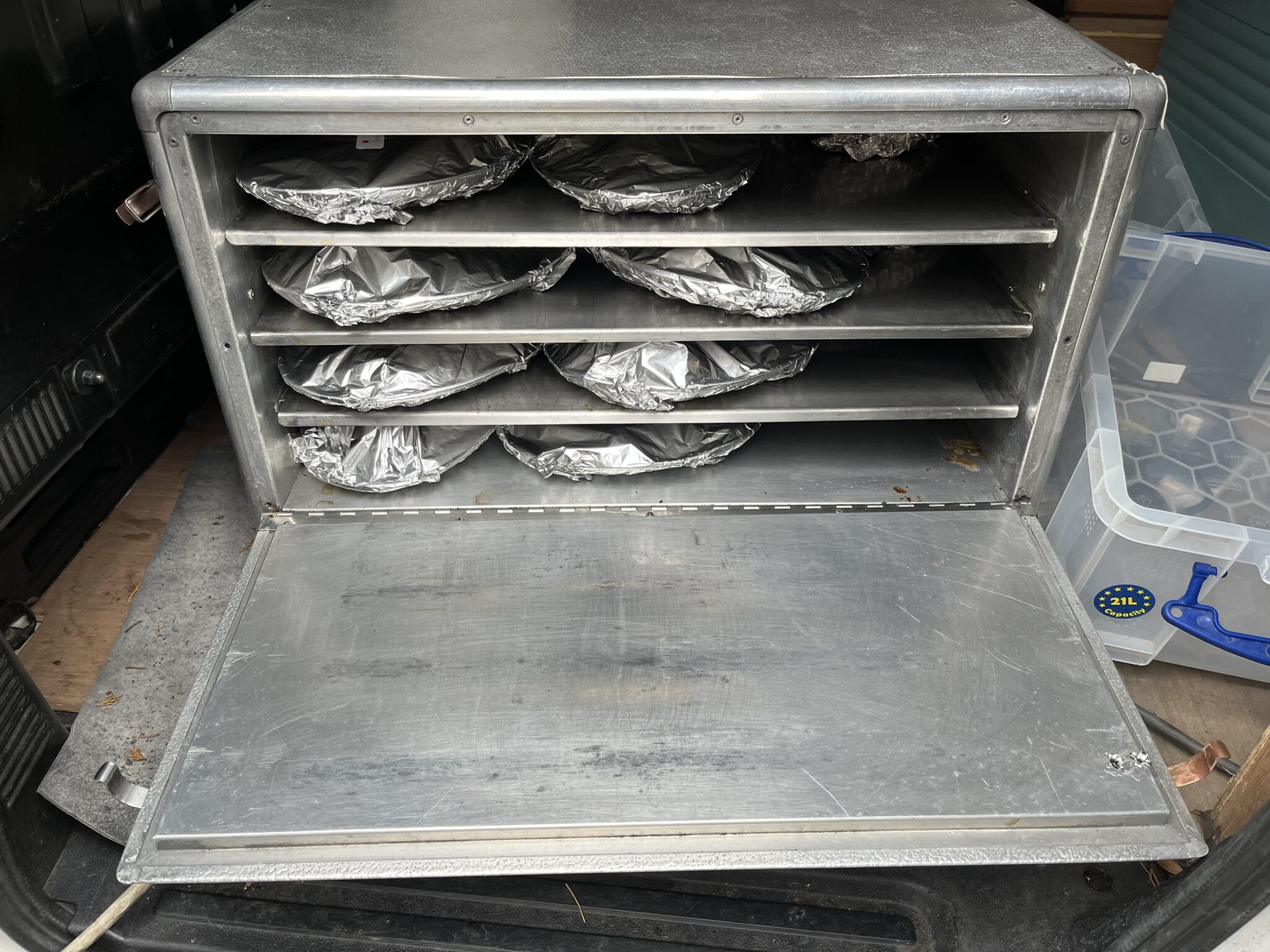 A hot food oven inside the delivery van